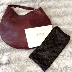 Gucci horse bit embossed hobo bag